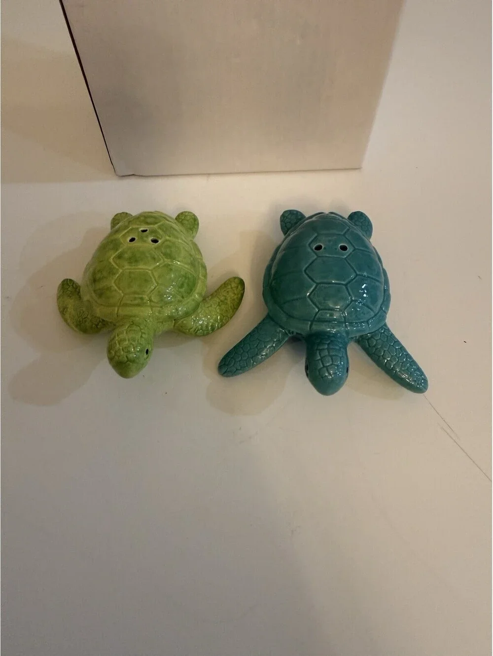 Cape Shore add a touch of ocean charm to your dining experience with the cape shore ceramic turtles salt & pepper set  colored in serene blue and green